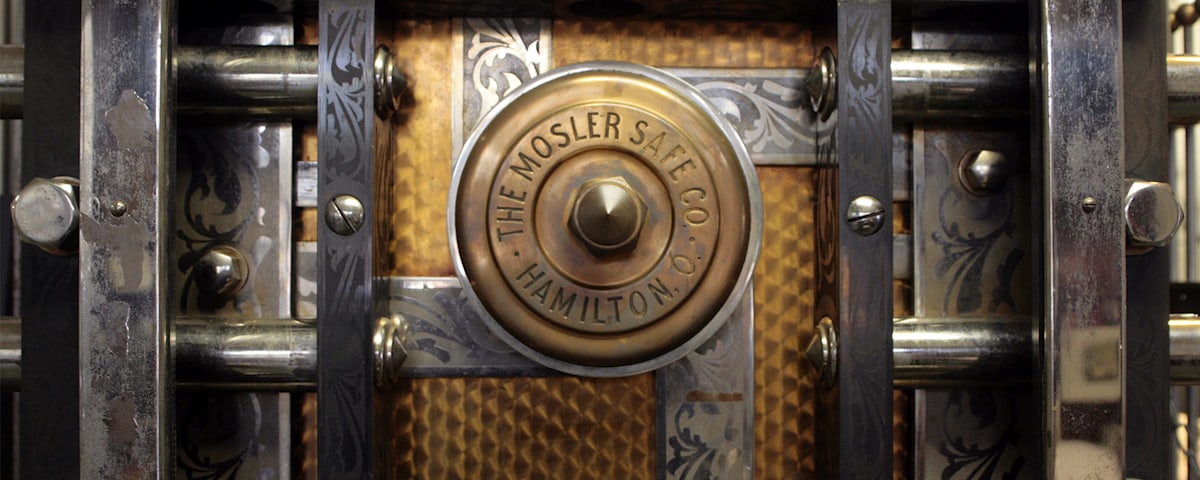The engraved steel door of an antique bank vault